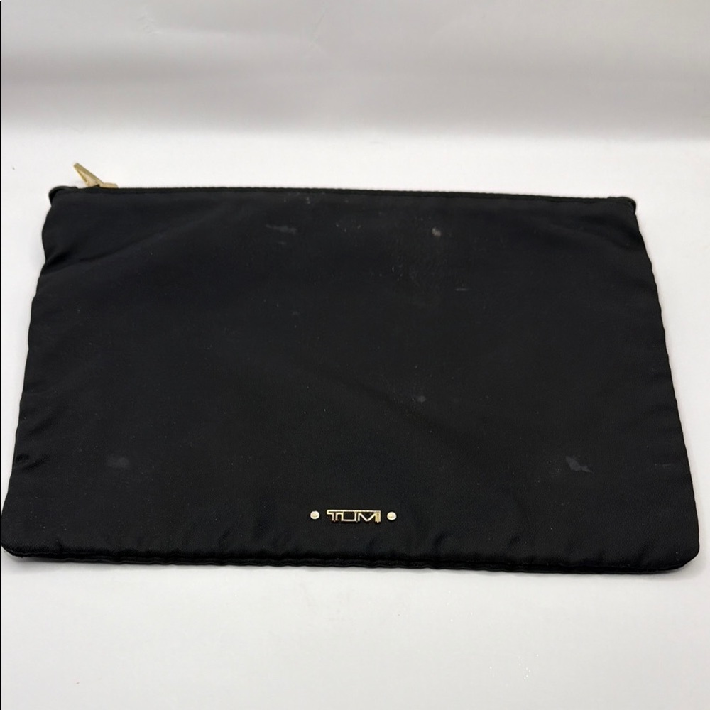 TUMI Black and Gold Pouch with Stains